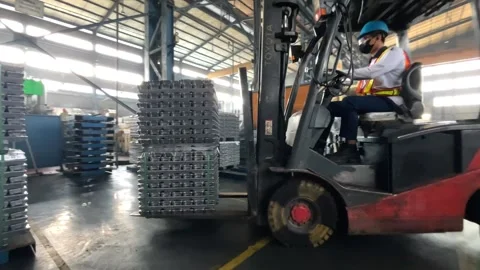 Factory Worker Operating Forklift to Organize Motorcycle Parts in Warehouse Stock Footage 308934708