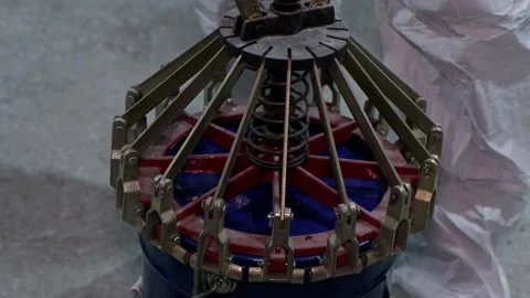 Factory worker operating industrial paint mixing machine Stock Footage 293692224