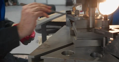 Factory worker operating industrial press machinery Stock Footage 340066103