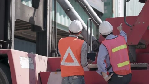 Factory worker people men standing in front of containers logistic in warehouse. Video stock 234263905