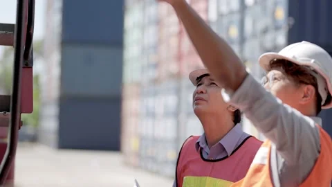 Factory worker people men standing in front of containers logistic in warehouse. Video stock 234264051