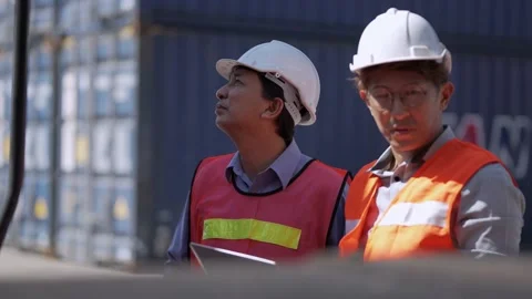 Factory worker people men standing in front of containers logistic in warehouse. Stock Footage 234264060