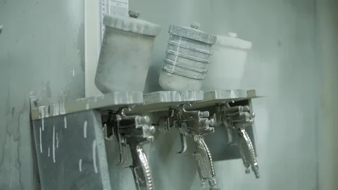 Factory worker picks up a spray gun Video stock 127957317