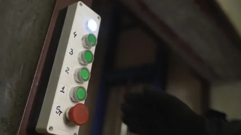 Factory worker pressing button on industrial control panel Stock Footage 335642151