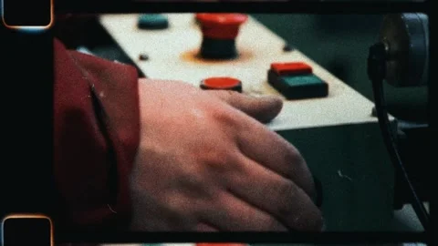 Factory worker pressing machine control panel button Stock Footage 345599880