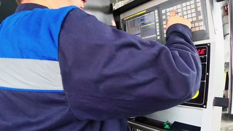 Factory worker is programming a CNC milling machine. 스톡 동영상 92436837