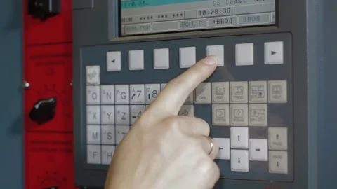 Factory worker is programming a CNC milling machine. Cutting metal modern 動画素材 127504129