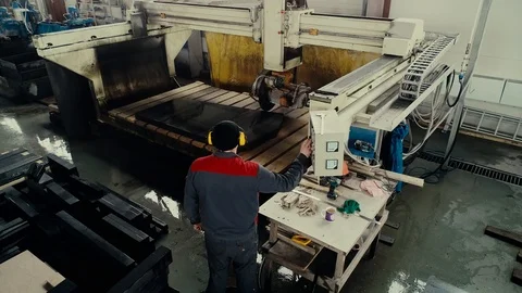 Factory worker programs factory CNC machine. Processing, granite cutting Video stock 106452403