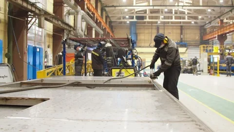 Factory worker in protective uniform and safety mask use metalworking machine Stock Footage 202049020