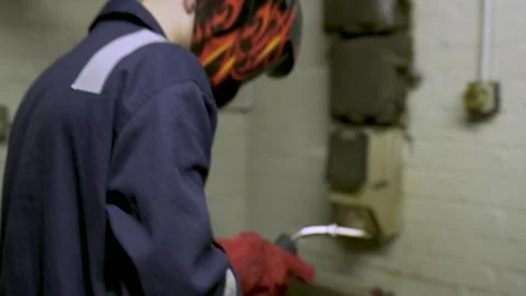 Factory Worker Pulls Down Flame Mask Stock Footage 152735706