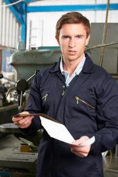 Factory Worker Reading Redundancy Letter Stock Photos