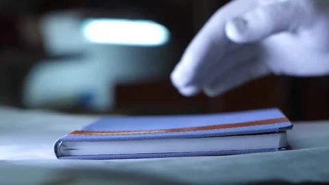 Factory worker reviews notebook quality in premium paper production plant. Stock Footage 313815379