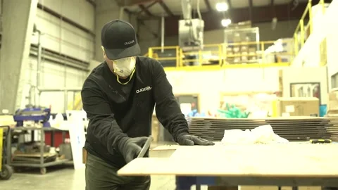 Factory - worker sands edges of plexiglass. Stock Footage 164999611