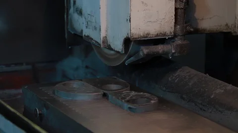 Factory worker sets metal workpiece in a grinding machine. Industrial concept Stock Footage 127506514
