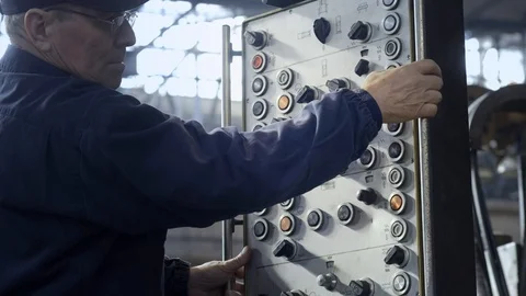 Factory Worker is Setting Up CNC Lathe Machine in Factory. Stock Footage 103604553