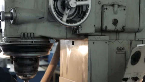 Factory Worker is Setting Up CNC Lathe Machine in Factory Stock Footage 111247414