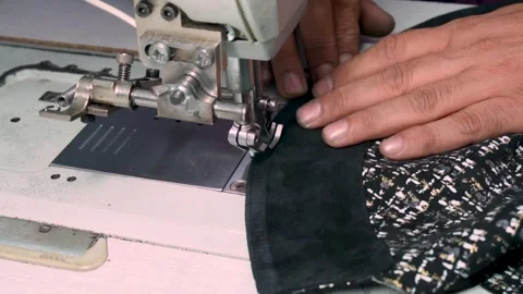 Factory Worker Sewing Leather Jacket Piece on Industrial Machine Stock Footage 322057774