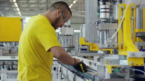 Factory worker sorting out his machine Stock Footage 63025773
