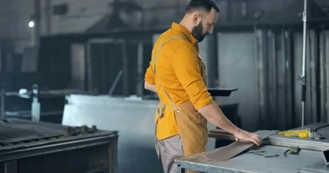 Factory worker with tablet and phone at the manufacturing Stock Footage 147291232