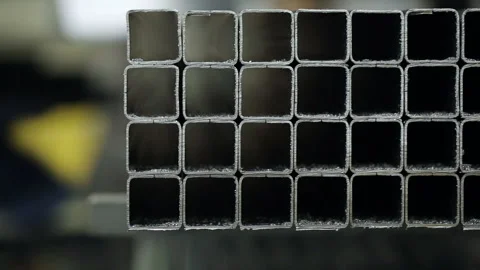 Factory worker takes a metal pipe off the shelf. At stock of industrial placemen Video stock 199486725