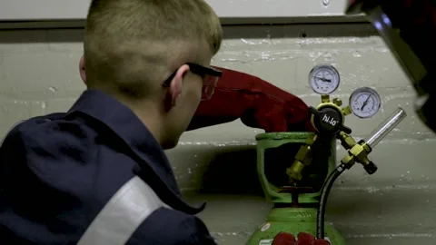 Factory Worker Turns on Gas Stock Footage 152735709