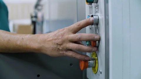 Factory Worker Turns On Heavy Machinery Stock Footage 159015284