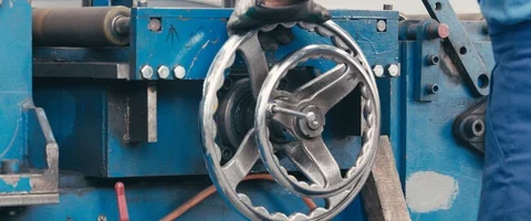 Factory worker turns valve in industrial steel mill  Video stock 90273655