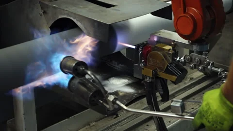 Factory worker uses flame spraying technology in precious metals factory Stock Footage 200873982