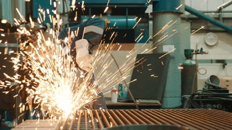 Factory worker using cutting equipment in slow motion 스톡 동영상 182404021