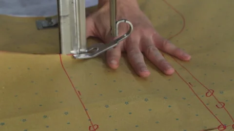 Factory Worker Using Electric Fabric Cutter Machine Video stock 247416678