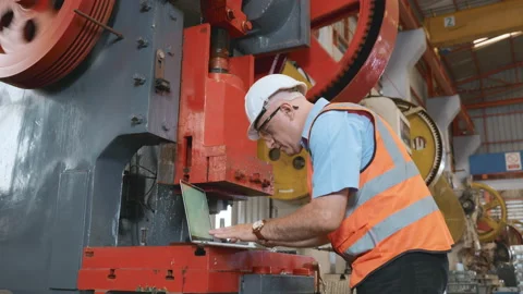 Factory worker using a laptop with an engineering software Stock Footage 172832852