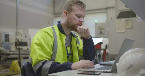 Factory worker using laptop Stock Footage 109334189