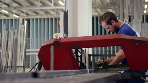 Factory worker using machines while at work Stock Footage 63030704