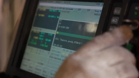 Factory worker using metal working machine for machining parts on industrial Stock-Footage 127504454