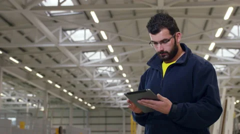 Factory worker using a tablet for work. Stock Footage 63032393