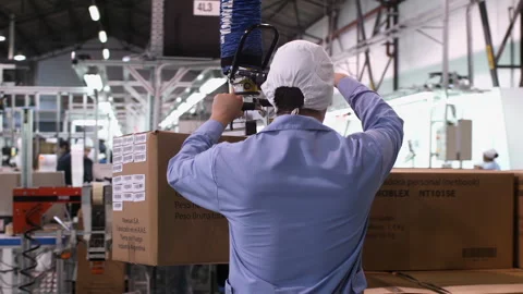 Factory Worker Using Vacuum Tube Lifter to Move Box, Electronics Factory - 4K Stock Footage 328371593