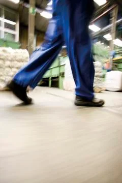Factory worker walking, low section Stock Photos