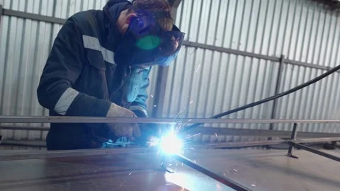 A factory worker welder gas welds a steel structure 스톡 동영상 166288251