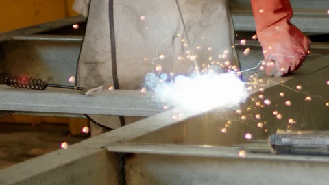 Factory worker welding and fire sparks coming out slow motion 動画素材 129962738
