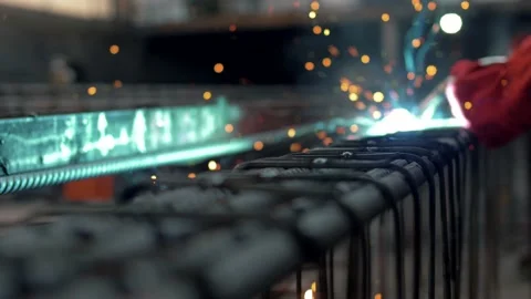 Factory worker welds metalwork close-up Stock Footage 135313360