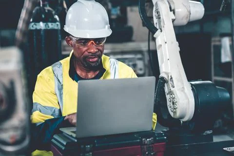 Factory worker working with laptop computer to do adept procedure checklist Stock Photos