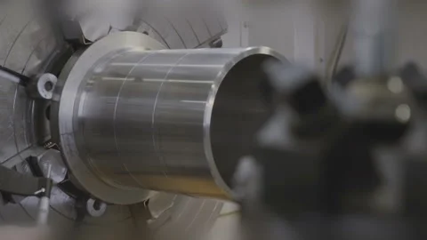 Factory worker working on a metal milling machine. Worker measuring a detail Stock-Footage 103354412