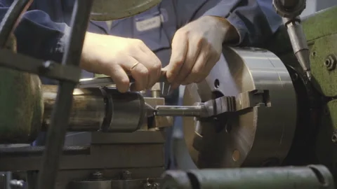 Factory worker working on a metal milling machine. Stock Footage 103355400