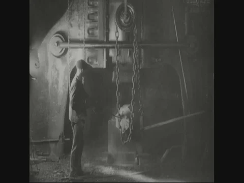 Factory workers are putting block under pressing machine to give shape - 1918 Stock Footage 83657569