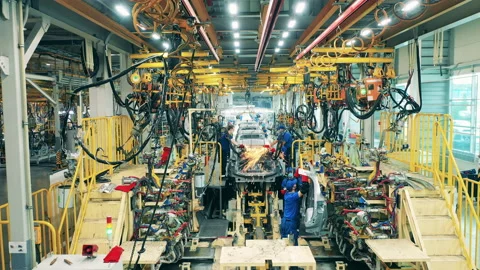 Factory workers assembling a car body at a car plant Stock-Footage 144552355
