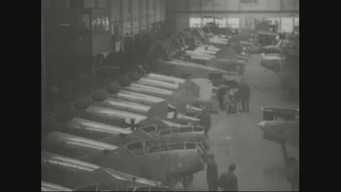Factory workers in assembly department assembling airplane parts - 1918 Stock Footage 83657631