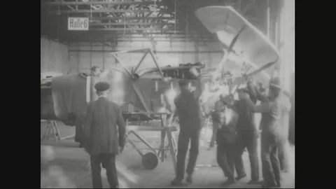 Factory workers in assembly department assembling airplane parts - 1918 Stock Footage 83657637
