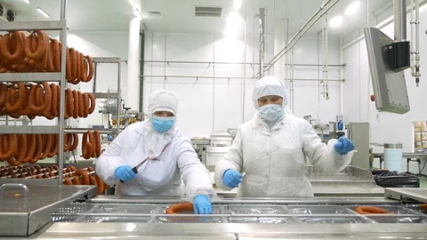 Factory workers make sausage meat processing plant Stock Footage 128324076