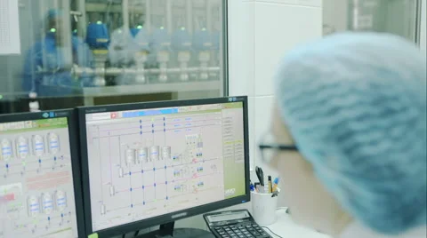 Factory Workers. Manufacturing. Worker control the production process on the Stock Footage 57205036