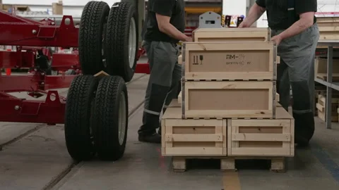 Factory workers move inventory and boxes, working in modern industrial factory Video stock 157611513